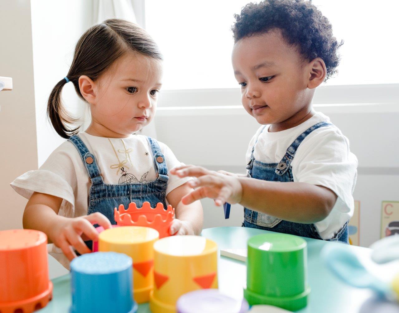 two toddlers playing building blocks in Tiny Tots Early Learning