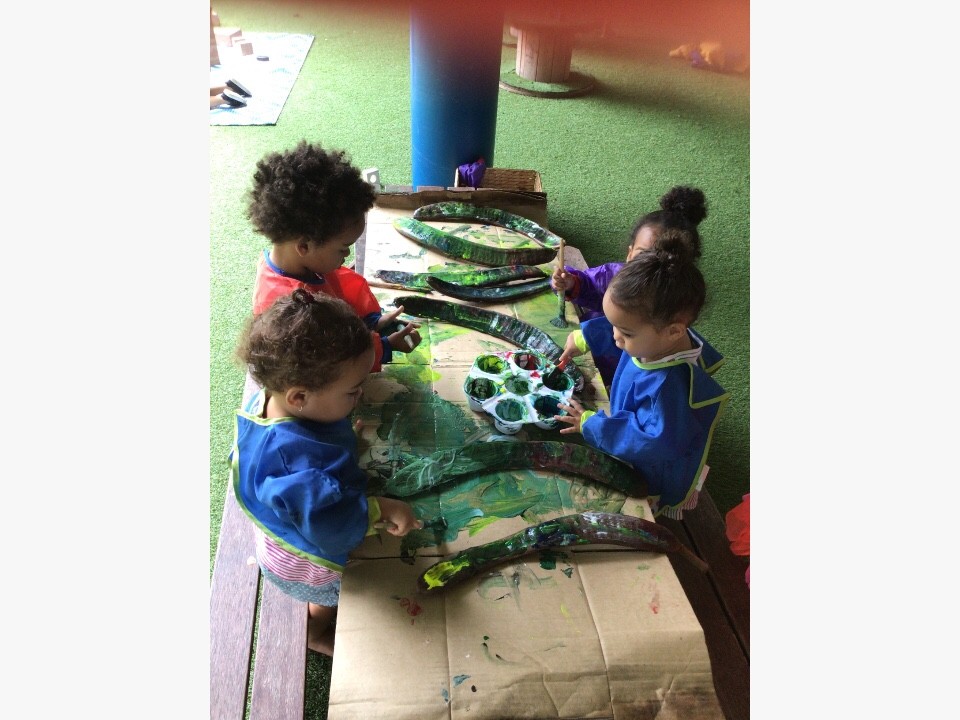 kids having colorful painting activities in Tiny Tots Early Learning Centre